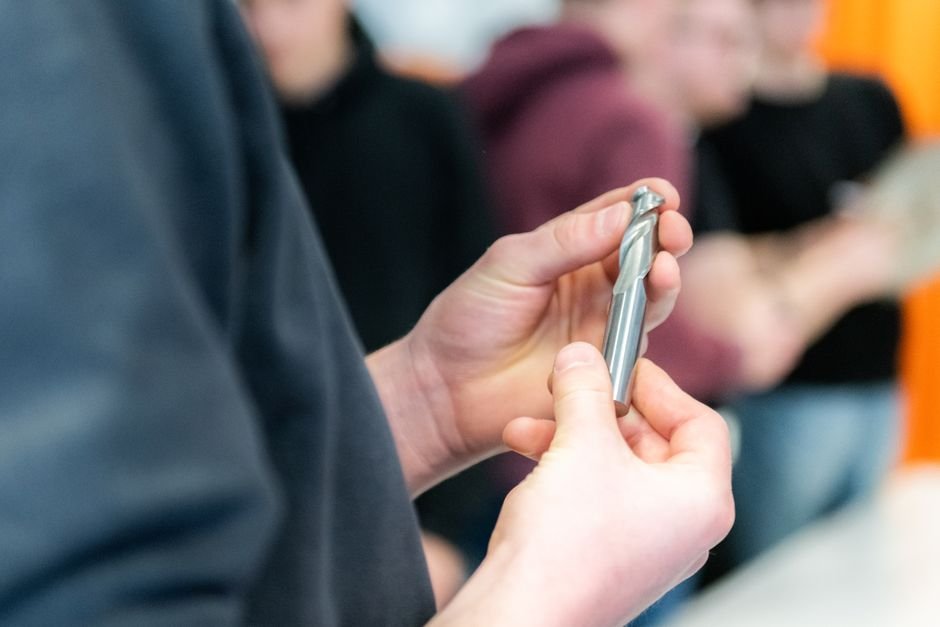 Engineering students working with equipment in a mechanical engineering laboratory