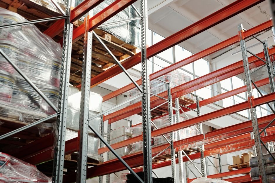 Modern warehouse with pallets and storage racks representing top universities in USA for supply chain management